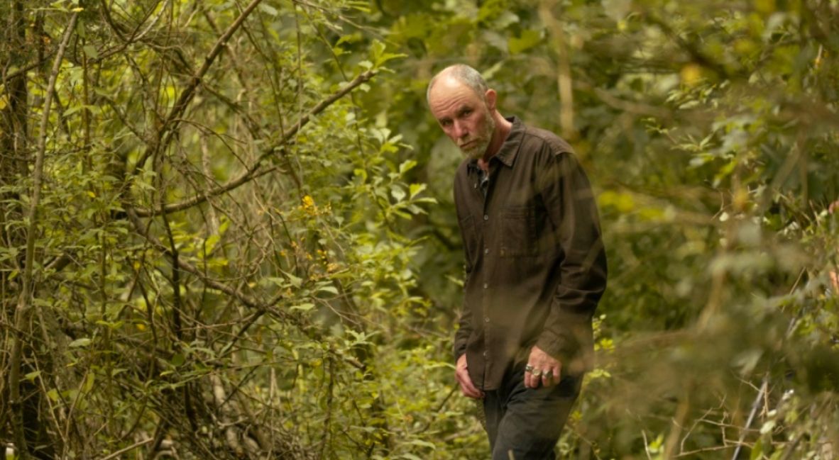 Perry walks in the woods in Task Episode 5