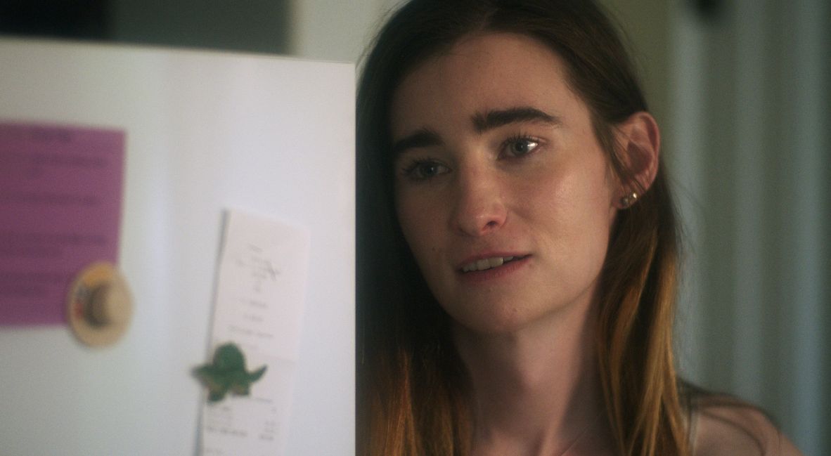 BHFF 2025: 'The Serpent's Skin' Is Experimental And Unapologetically Queer 1 Anna, played by Alexandra McVicker, standing in a kitchen in The Serpent's Skin